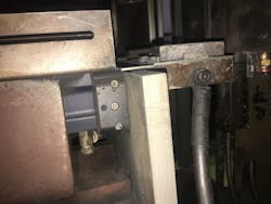 Fig. 3: Shows the gripper from the side. The pneumatics and sensors are installed behind an aluminum plate for protection Fig. 3: Shows the gripper from the side. The pneumatics and sensors are installed behind an aluminum plate for protection