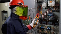 Worker Measuring Electronics Worker Measuring Electronics