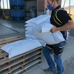 HeroWear worker demonstrating exosuit HeroWear worker demonstrating exosuit