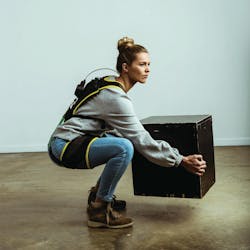 HeroWear worker demonstrating exosuit HeroWear worker demonstrating exosuit