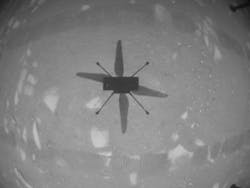 The helicopter&apos;s camera photographed the ground with the shadow during the flight.