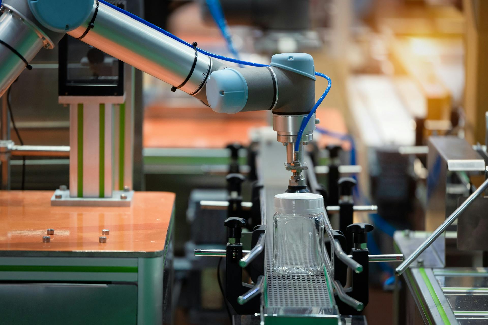 Image Robotic Arm Machine In Factory Picked Up The Plastic Bottle Packaging For Food 608042ba3d113