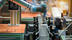 Robotic Arm Machine In Factory Picked Up The Plastic Bottle Packaging For Food