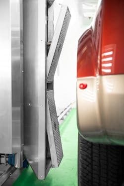 Thomson linear units mounted on the back of the upper shutter enable operators to position the heat lamp optimally in relation to the contoured wheel well of the vehicle. Thomson linear units mounted on the back of the upper shutter enable operators to position the heat lamp optimally in relation to the contoured wheel well of the vehicle.