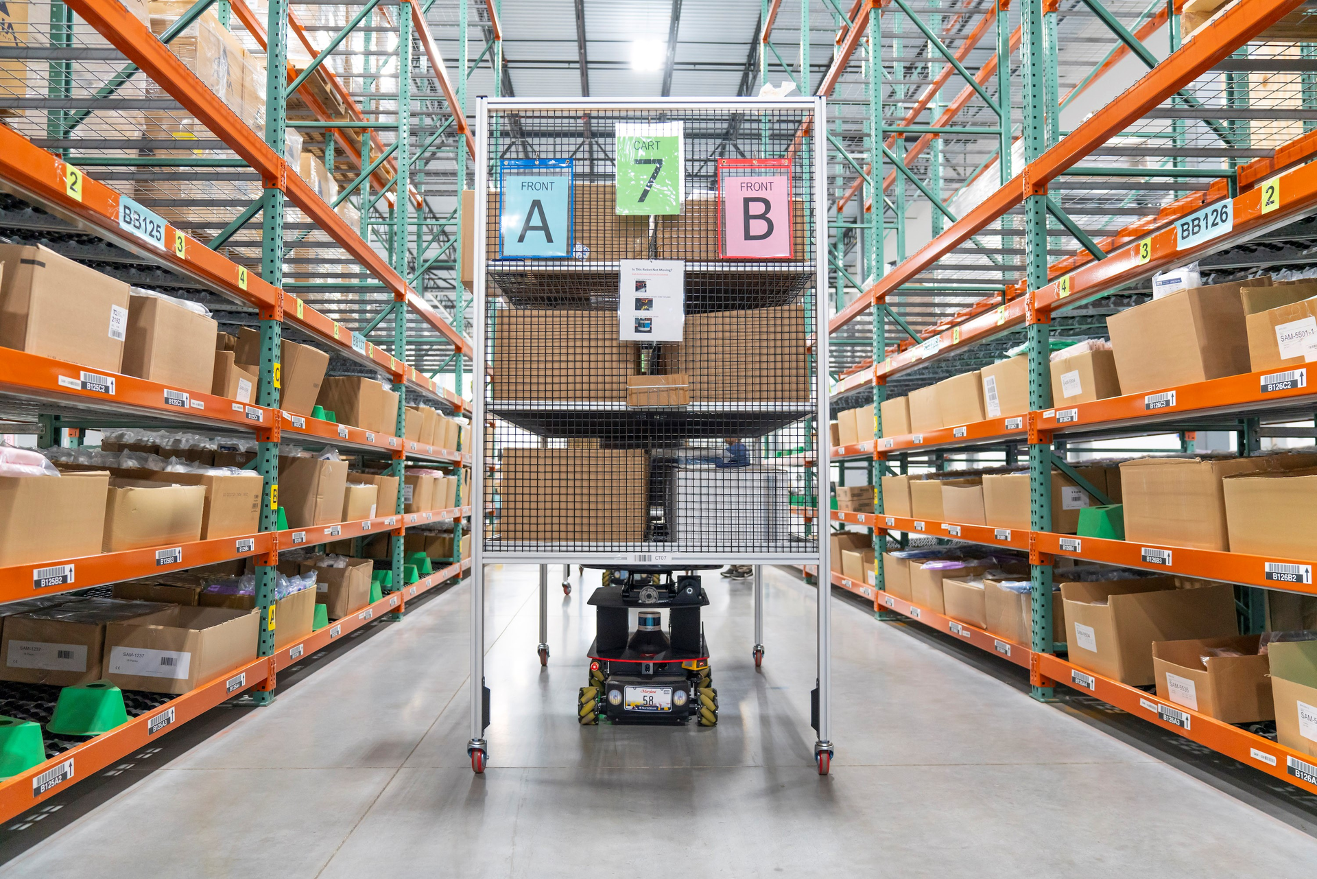 One of six AMRs at the North Shore facility is heading to meet up with an associate at the next pick location.