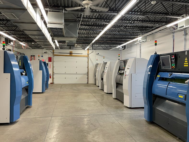 Rows of additive manufacturing machines waiting for their next build orders at Metalcraft Solutions.