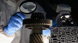 Man Examining Metal Man Examining Metal