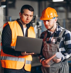 Workers Looking At Computer Workers Looking At Computer