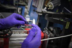 Technician performing final Hipot testing on gearmotor electrical connections. Technician performing final Hipot testing on gearmotor electrical connections.