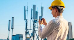Industrial Worker Using 5G phone Industrial Worker Using 5G phone