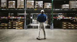 Man Looking at Inventory at Warehouse