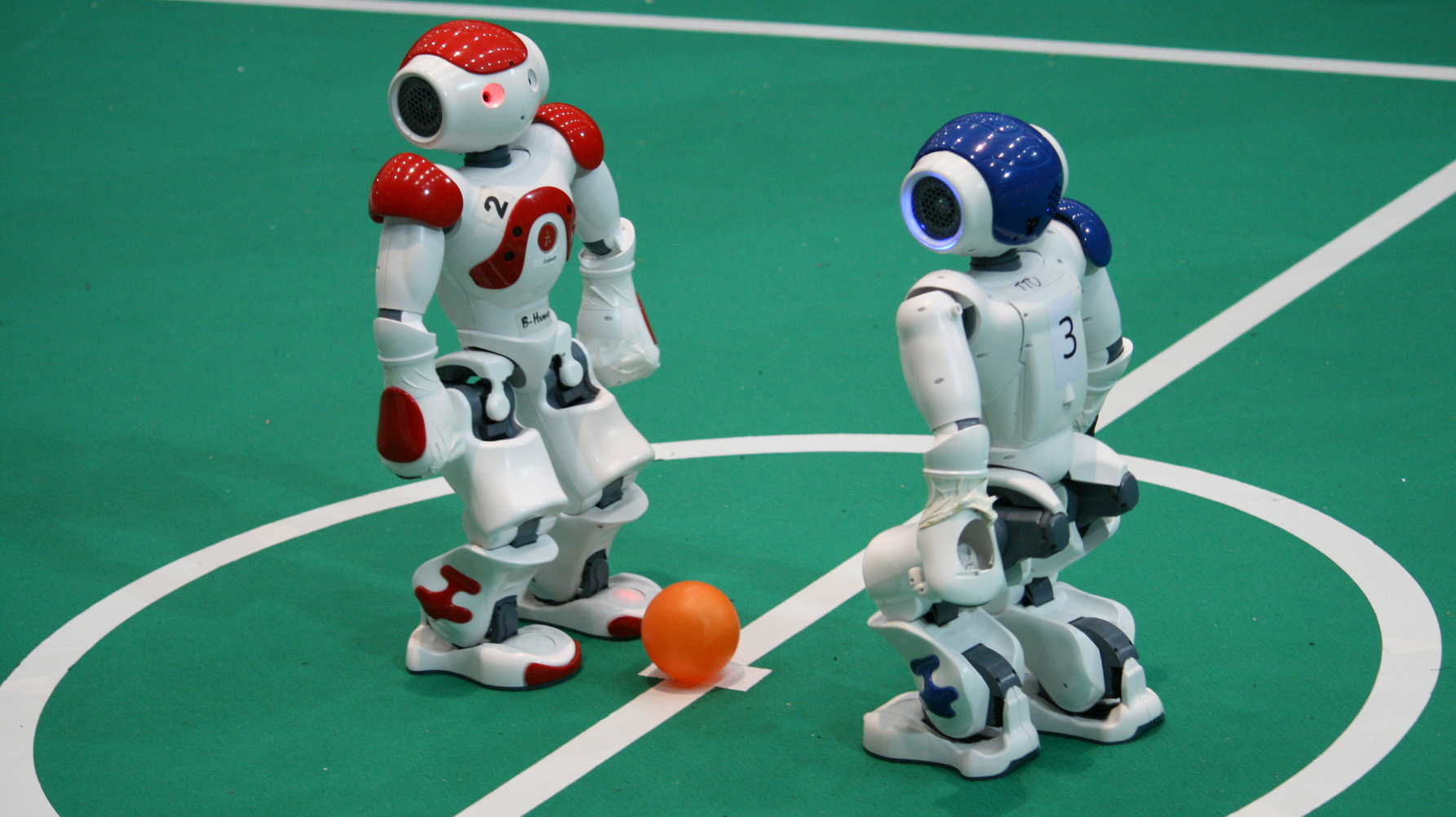 Robots playing soccer