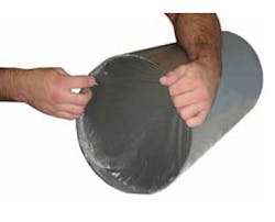 Figure 2: Soluble weld purge film being applied to a pipe end. Figure 2: Soluble weld purge film being applied to a pipe end.