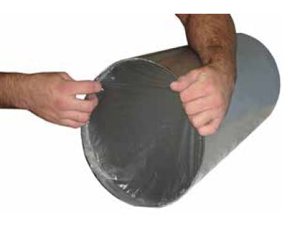 Figure 2: Soluble weld purge film being applied to a pipe end.