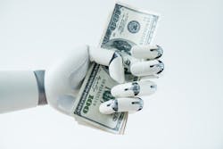 close-up view of robot holding dollar banknotes close-up view of robot holding dollar banknotes
