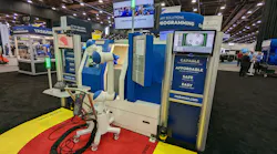 A mobile robot autonomously manages a machine tool at Yaskawa's booth at the AUTOMATE trade show in Detroit, MI.
