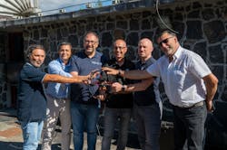 Skypersonic CEO Giuseppe Santangelo, fourth from left, and colleagues, hold a Skycopter drone. Skypersonic CEO Giuseppe Santangelo, fourth from left, and colleagues, hold a Skycopter drone.