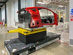 A Lotus Emira being delivered by an automated guided vehicle from the production line to the LK CMM to undergo stage 1 inspection. A Lotus Emira being delivered by an automated guided vehicle from the production line to the LK CMM to undergo stage 1 inspection.