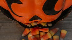 Ceramic Pumpkin Candy Dish With Candy Corn Spilling Out Ceramic Pumpkin Candy Dish With Candy Corn Spilling Out