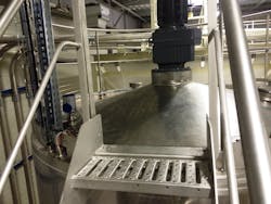 OPTIWAVE 3500 C 80 GHz FMCW radar level transmitter installed on top of a tank at a facility producing a range of confectionery products. OPTIWAVE 3500 C 80 GHz FMCW radar level transmitter installed on top of a tank at a facility producing a range of confectionery products.