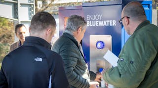 Rush to fill sustainable water bottles with Bluewater at 21st century EV recharging hub where single-use plastic bottles of water are made a thing of the past.