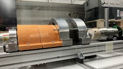 Electric machine with 3D printed parts in the middle, orange 3D printed cable cover on the left, and smart shaft as a load on the right. Electric machine with 3D printed parts in the middle, orange 3D printed cable cover on the left, and smart shaft as a load on the right.