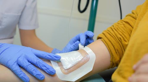 Adhesive Bandage On Patient Arm