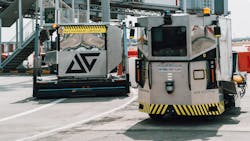 The Auto-Dolly traveling autonomously along a road in the airside at Changi Airport with a luggage container. The Auto-Dolly traveling autonomously along a road in the airside at Changi Airport with a luggage container.