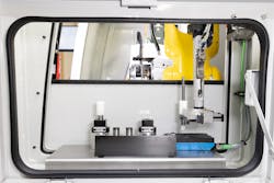 An inside view of ANCA's FX-RFID automated regrinding system using the robot to RFID scan on an ANCA machine. An inside view of ANCA's FX-RFID automated regrinding system using the robot to RFID scan on an ANCA machine.