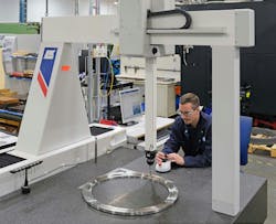 Close-up view of Dave Eldridge inspecting a fixture on the LK G90C 10.10.8. Close-up view of Dave Eldridge inspecting a fixture on the LK G90C 10.10.8.