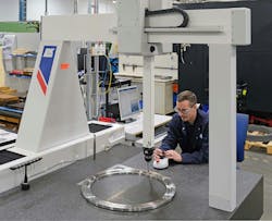 Close-up view of Dave Eldridge inspecting a fixture on the LK G90C 10.10.8. Close-up view of Dave Eldridge inspecting a fixture on the LK G90C 10.10.8.