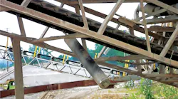 Unguarded return rollers over walkways can fall and produce a serious hazard.