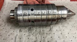 Old bearing assembly showing six bearings separate by a spacer, with replaceable nose. This is a used assembly in for repair. Old bearing assembly showing six bearings separate by a spacer, with replaceable nose. This is a used assembly in for repair.