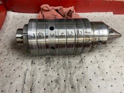 Old bearing assembly showing six bearings separate by a spacer, with replaceable nose. This is a used assembly in for repair. Old bearing assembly showing six bearings separate by a spacer, with replaceable nose. This is a used assembly in for repair.