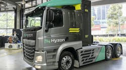 Hyzon&rsquo;s Prime Mover in the foreground with John Edgley, Managing Director, Hyzon Australia standing by the newly introduced single stack 200kW fuel cell system, which powers the vehicle.