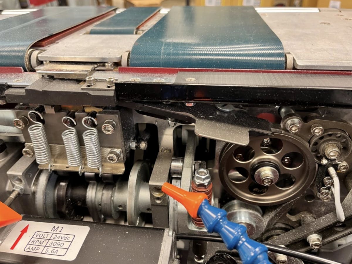 After the test: With constant air, you can see a significant reduction in debris in the strapping guides and around the cutting tool area.