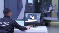 A Heitec engineer monitors a robotic CT scan and analysis system as it inspects a manufactured component. A Heitec engineer monitors a robotic CT scan and analysis system as it inspects a manufactured component.