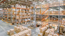 Large industrial warehouse with racks completely filled with boxes and containers. Large industrial warehouse with racks completely filled with boxes and containers.