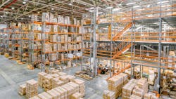 Large industrial warehouse with racks completely filled with boxes and containers. Large industrial warehouse with racks completely filled with boxes and containers.