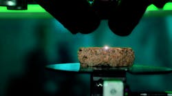 Close-up of ABLASCAN scanning the material of a rock with plasma beam. Close-up of ABLASCAN scanning the material of a rock with plasma beam.