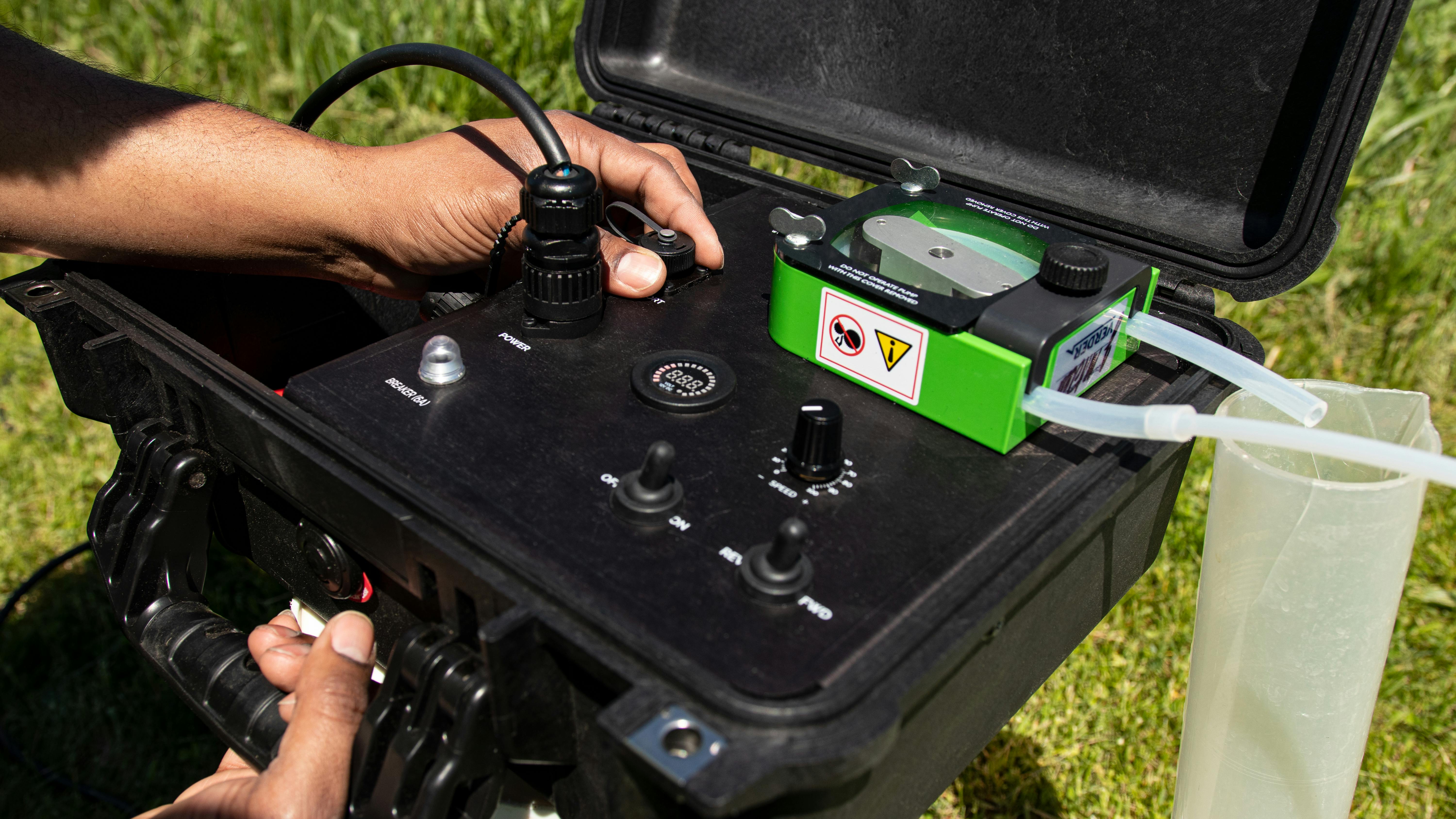 MicroPurge MP100 peristaltic pump in use in the field