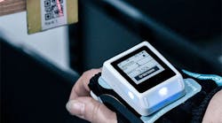 Kardex Wearable Task Assistant for picking operations in use on employees wrist scanning a barcode Kardex Wearable Task Assistant for picking operations in use on employees wrist scanning a barcode