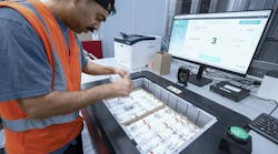 Kardex worker using the integrated Paccurate solution to pack an order. Kardex worker using the integrated Paccurate solution to pack an order.