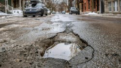 Large deep pothole in Montreal street, Canada. Large deep pothole in Montreal street, Canada.