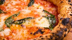 Close-up of artisinal, wood-fired margherita pizza Close-up of artisinal, wood-fired margherita pizza