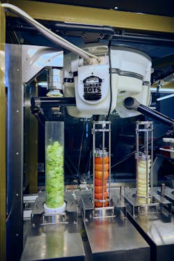 The IRB 360 FlexPicker taking ingredients and loading them on the burgers. The IRB 360 FlexPicker taking ingredients and loading them on the burgers.