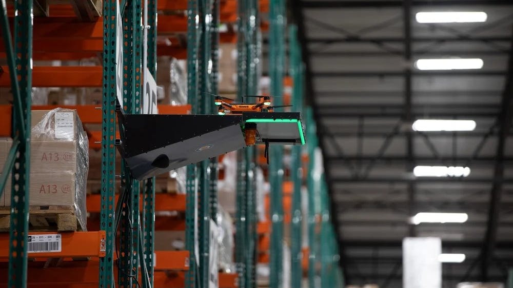 Corvus One drone in warehouse, docking on charger