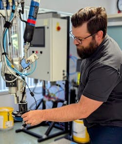Jared Rogers, Application Engineering Manager, adjusts a Coherix 3D sensor for inline, adhesive inspection and process control. Jared Rogers, Application Engineering Manager, adjusts a Coherix 3D sensor for inline, adhesive inspection and process control.