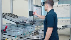 Worker at ergonomic workstation Worker at ergonomic workstation