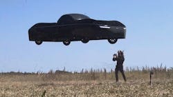 CEO Jim Dukhovny near the Model A during a test flight in a field. CEO Jim Dukhovny near the Model A during a test flight in a field.